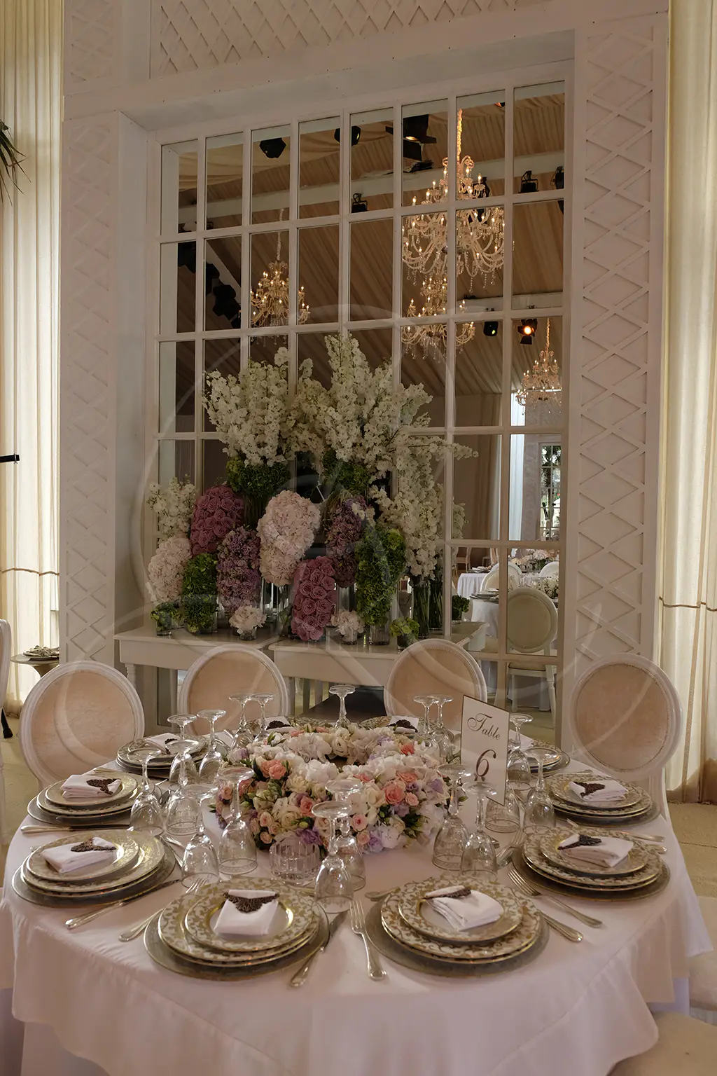 Gala table dressed with fine tableware, crystal glasses and understated floral arrangement, Rahal Maître Traiteur