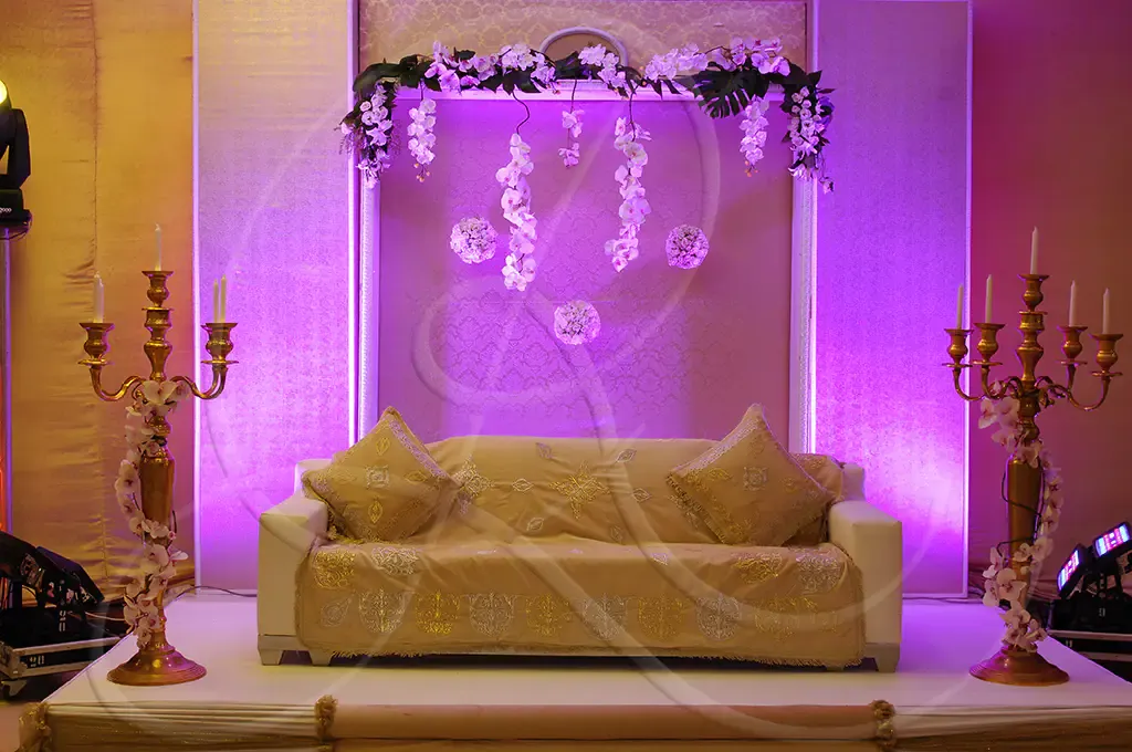 Wedding stage, gilded sofa and candelabras, floral ceremony decor, Rahal Maître Traiteur